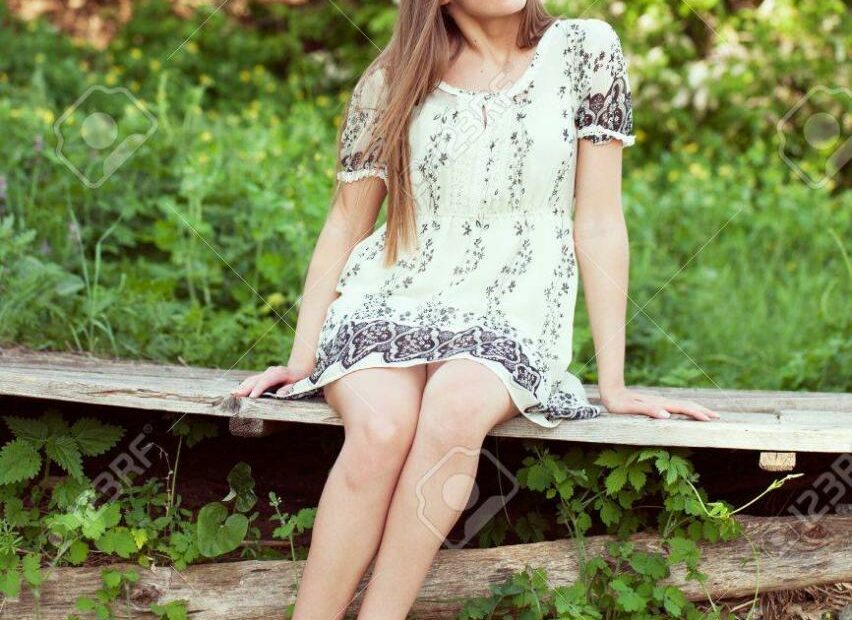 Girl In A Summer Dress Sitting And Relaxing Summer Day Stock Photo, Picture  And Royalty Free Image. Image 20085509.