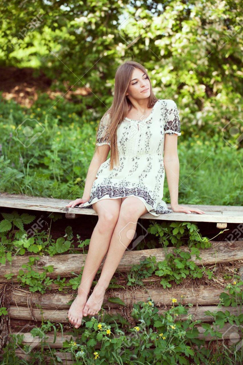 Girl In A Summer Dress Sitting And Relaxing Summer Day Stock Photo, Picture  And Royalty Free Image. Image 20085509.